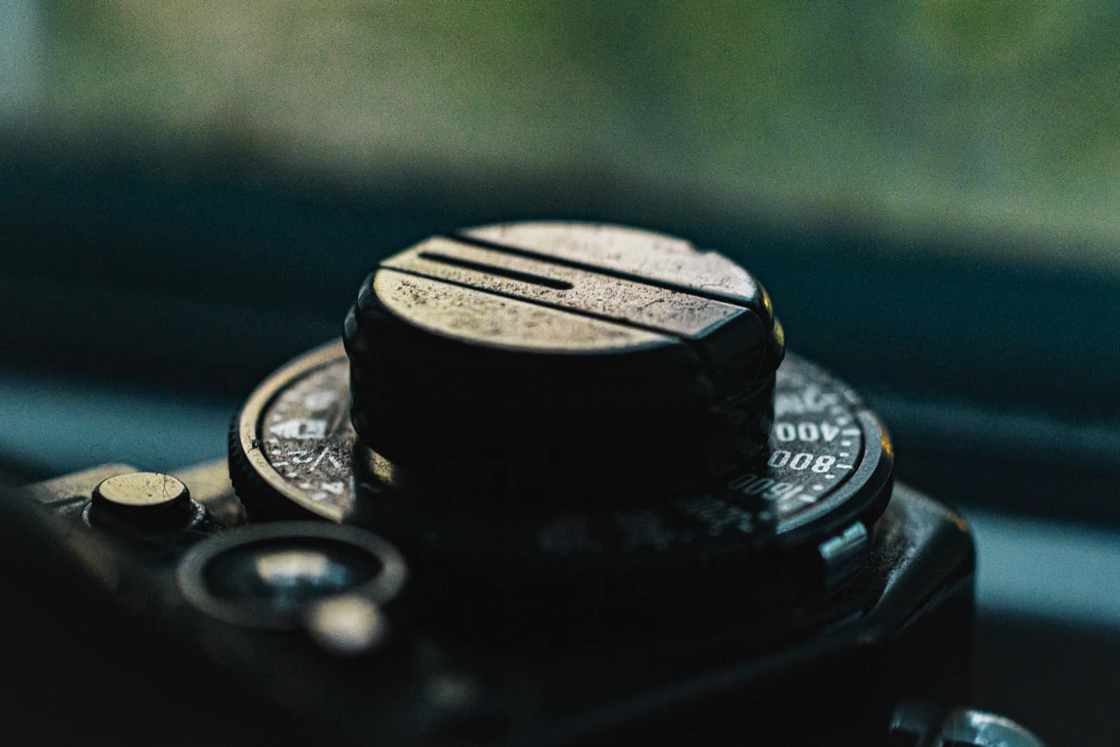 Shallow-depth-of-field shot of the top of a classic camera with its dials