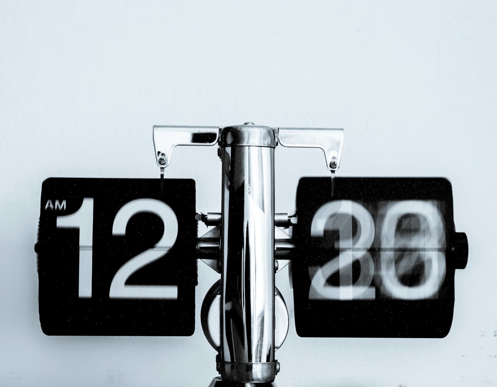 Flip clock showing 12:20 against a white background