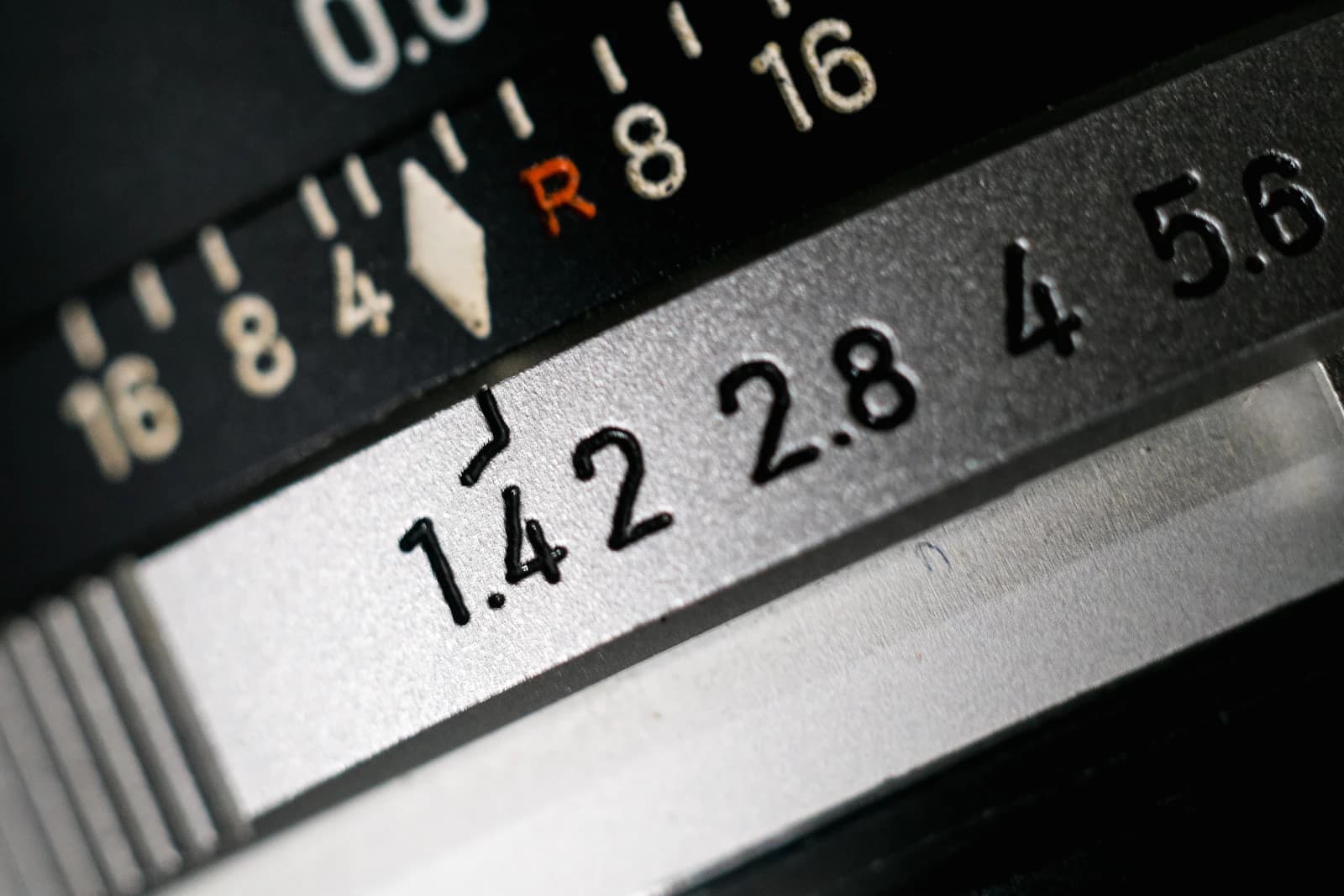 Aperture ring of a classic lens engraved with f-numbers such as 1.4, 2.8, 4 and 5.6