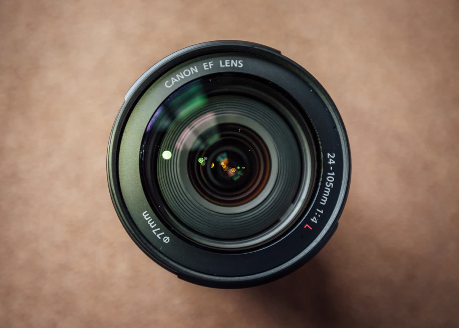 Top-down view of a zoom lens on a brown background