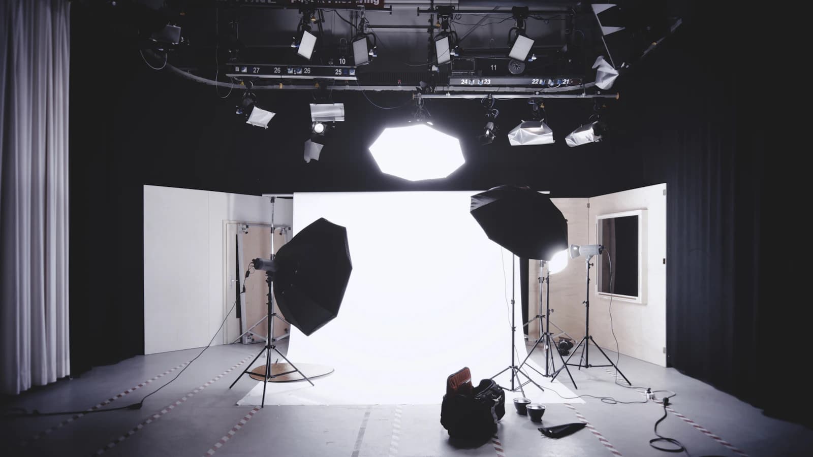 Photography studio with softbox lights and a white backdrop